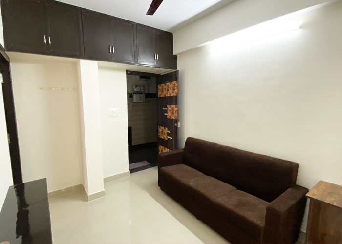 Living area with sofa at S V Moon Homes in Munnekollal