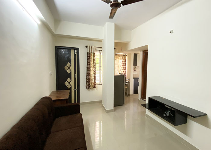Living area looking toward the kitchen at S V Moon Homes in Munnekollal
